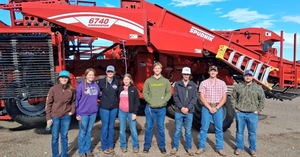 From left to right — Wyatt Ozenbaugh of Ohiowa, Nebraska; Aaron Underwood of Esbon, Kansas; Jada Eilert of Jewell, Kansas; Paige Davis of Bartlett, Kansas; Hailey Loutzenhiser of Flagler, Colorado; Mason Semler of Friend, Nebraska; KaCee Jo Saffer of Arriba, Colorado; and Conrad Burrow of Wheatland, Wyoming stand in front of the harvester at Frenchman Valley Produce in Imperial, Nebraska. Their field trip offered a hands-on look at modern potato production, processing, and the region’s vital role in Nebraska agriculture. Photo from Dr. Brad Ramsdale