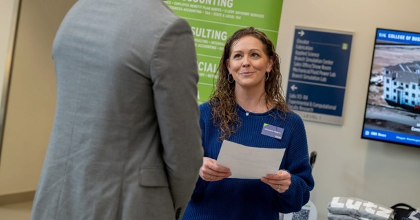 Christina Holton, a corporate recruiter with Lutz, meets with a student during an event hosted by the UNK College of Business and Technology. (Photo by Ryo Suzuki, UNK College of Business and Technology)