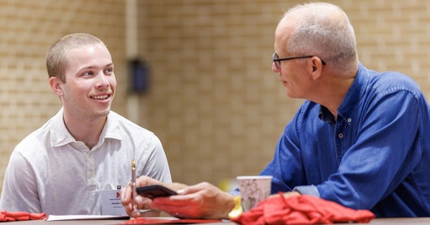 Swade Lamb (left), a sophomore international business major, speaks with a mentor during the Rural Fellows Academy inside the Nebraska East Union. Lamb will work with United Way of South Central Nebraska in Hastings. (Jordan Opp/University Communication and Marketing)
