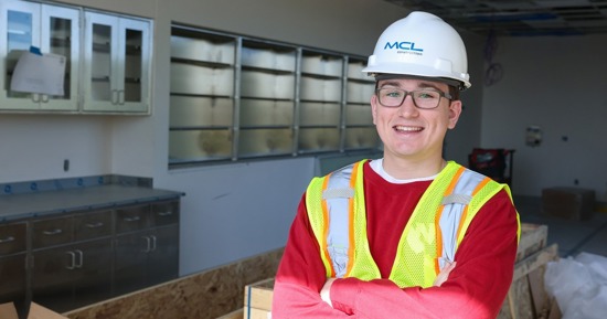 Carter Schultz poses for a photo inside the new Health Science Education Center II on the UNK campus during a recent tour. He’ll attend professional school there as part of the inaugural cohort of students enrolled in the UNMC pharmacy program launching in Kearney. (Photo by Erika Pritchard, UNK Communications)