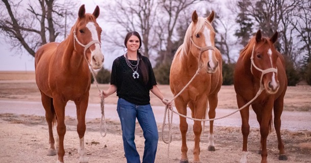 Kelsey Lauenstein and three horses special to her: Foxi (in the middle), Scarlett, Foxi’s dam (on the left), and Sweets, a half-sister to Foxi (on the right). The Shickley cowgirl is a barrel racer. Photo courtesy Lauenstein. 